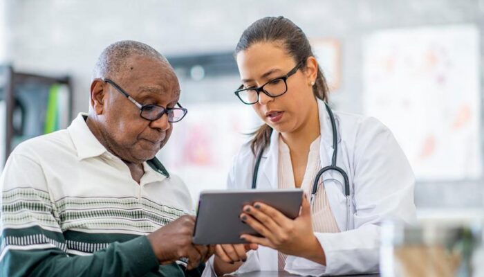 Doctor reviewing longevity test results with a client